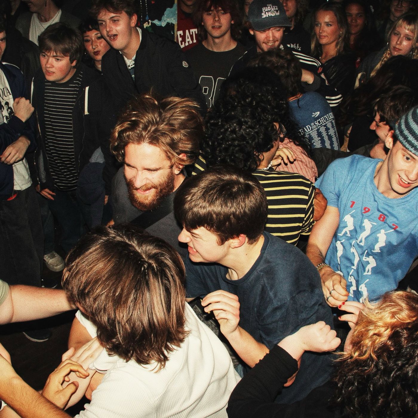 The crowd moshing at the front